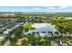 Aerial view of a community showcasing lake, playground, walking trails, and serene waterfront living at 1722 Trewin Ct, Charleston, SC 29492