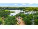 Aerial view of a community featuring a lake, playground, walking trails, and beautiful trees at 1722 Trewin Ct, Charleston, SC 29492