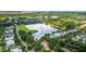 Aerial view of community featuring a lake, walking trails, playground, and lush green trees at 1722 Trewin Ct, Charleston, SC 29492