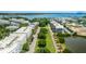 Aerial view of a community featuring modern apartments, lush landscaping, and a serene pond at 1722 Trewin Ct, Charleston, SC 29492