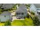 Aerial view showcases a home with a backyard, patio, and charming neighborhood at 1722 Trewin Ct, Charleston, SC 29492