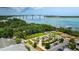 Scenic aerial view showcasing the waterfront access, lush landscaping, and bridge beyond at 1722 Trewin Ct, Charleston, SC 29492