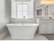Serene bathroom featuring a standalone tub and an open window with natural light at 1722 Trewin Ct, Charleston, SC 29492