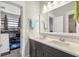 Modern bathroom features a double sink vanity and opens into the bunk room at 1722 Trewin Ct, Charleston, SC 29492