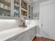 Butlers Pantry featuring stone backsplash, custom wine racks and premium cabinets at 1722 Trewin Ct, Charleston, SC 29492