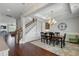 Open-concept dining room with hardwood floors and a view of the staircase at 1722 Trewin Ct, Charleston, SC 29492