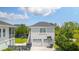 Detached two-car garage with a basketball hoop and an outdoor play area in the backyard at 1722 Trewin Ct, Charleston, SC 29492