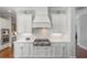 Gourmet kitchen featuring a stainless steel gas cooktop and custom range hood at 1722 Trewin Ct, Charleston, SC 29492