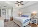 Spacious main bedroom with tray ceiling, area rug and a window letting in natural light at 1722 Trewin Ct, Charleston, SC 29492