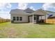 Backyard featuring an enclosed screened-in porch and a wood fence at 1888 Nola Run, Summerville, SC 29485