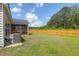 Fenced backyard featuring a screened in porch and manicured lawn at 1888 Nola Run, Summerville, SC 29485
