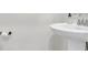 Clean, minimalist bathroom featuring a white pedestal sink and simple fixtures at 1888 Nola Run, Summerville, SC 29485