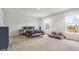 Spacious bedroom featuring neutral walls, a bed, and bright windows at 1888 Nola Run, Summerville, SC 29485