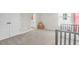 Bright bedroom with neutral walls, double door closet, and woven storage box at 1888 Nola Run, Summerville, SC 29485
