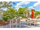 Outdoor community seating area, featuring tables, chairs, gazebo, and lush landscaping in Summers Corner at 1888 Nola Run, Summerville, SC 29485