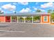 Bright orange community pavilion with picnic tables, offering a shaded space for gatherings and events at 1888 Nola Run, Summerville, SC 29485