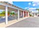 Community pavilion with picnic tables and overhead lighting, providing a comfortable space for gatherings at 1888 Nola Run, Summerville, SC 29485