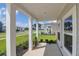 Inviting front porch with classic columns offering a welcoming space at 1888 Nola Run, Summerville, SC 29485