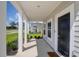 Charming front porch with classic columns and space for seating at 1888 Nola Run, Summerville, SC 29485
