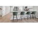 Contemporary kitchen featuring a quartz countertop, stainless steel appliances, and seating at the bar at 1888 Nola Run, Summerville, SC 29485