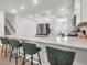 Bright kitchen with an island, stainless steel appliances, and modern finishes at 1888 Nola Run, Summerville, SC 29485