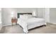 Spacious main bedroom featuring a plush bed with soft linens, with an entrance to the Primary bathroom at 1888 Nola Run, Summerville, SC 29485