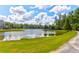 Picturesque pond view with lush green surroundings, enhancing the serene and natural beauty of the community at 1888 Nola Run, Summerville, SC 29485