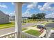 View from the porch of a sunny street with sidewalks and well-maintained homes at 1888 Nola Run, Summerville, SC 29485