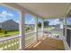 View from covered porch showcasing neighborhood street at 1888 Nola Run, Summerville, SC 29485