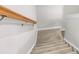 Well-lit staircase with carpeted steps and a wooden handrail at 1888 Nola Run, Summerville, SC 29485