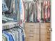 Organized walk-in closet with custom shelving, hanging rods, and drawers for storage at 1888 Nola Run, Summerville, SC 29485