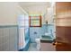 Small, bright bathroom featuring vintage blue tile and a shower/tub combo at 1900 Morgan Ave, North Charleston, SC 29406