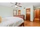 Bedroom with a wood bed frame, ceiling fan, and hardwood floors at 1900 Morgan Ave, North Charleston, SC 29406