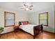 Bedroom with dark wood trim, hardwood floors, and natural light at 1900 Morgan Ave, North Charleston, SC 29406