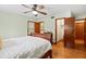 Bedroom with a wood bed frame, ceiling fan, and open closet at 1900 Morgan Ave, North Charleston, SC 29406