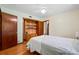 Bedroom featuring hardwood floors, built-in wooden cabinet, and neutral wall colors at 1900 Morgan Ave, North Charleston, SC 29406