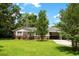 Lovely single-story home with a lush green lawn, mature trees, and an attached carport, offering comfort and convenience at 1900 Morgan Ave, North Charleston, SC 29406