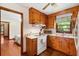 Compact kitchen featuring wood cabinets, modern appliances, and a functional layout, creating a practical cooking space at 1900 Morgan Ave, North Charleston, SC 29406