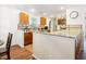 Cozy kitchen featuring warm wood cabinets, tile backsplash, granite countertops, and modern appliances at 214 E Edgefield Dr, Summerville, SC 29483