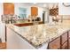 Bright kitchen with granite countertops, stainless steel appliances, and ample cabinet space at 214 E Edgefield Dr, Summerville, SC 29483