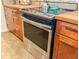 Modern kitchen stainless steel oven nestled between beautiful wood cabinets and butcher block countertops at 214 E Edgefield Dr, Summerville, SC 29483