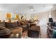 Spacious living room with a large sectional sofa, hardwood floors, and a view into the adjacent kitchen at 214 E Edgefield Dr, Summerville, SC 29483