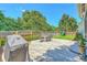 Beautiful backyard featuring a large patio, green lawn, and a playset, great for Gathering activities at 2150 Terrabrook Ln, Charleston, SC 29412