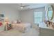 Cozy bedroom with natural light, bookshelf, and soft furnishings at 2150 Terrabrook Ln, Charleston, SC 29412