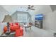Upstairs bonus room with cozy seating, ceiling fan, and plenty of natural light at 2150 Terrabrook Ln, Charleston, SC 29412