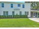 Charming home exterior with a well-maintained lawn, screened porch, and stylish architectural details at 2150 Terrabrook Ln, Charleston, SC 29412