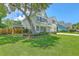 Beautiful two-story home with a well-kept lawn, mature trees, and a welcoming front facade at 2150 Terrabrook Ln, Charleston, SC 29412