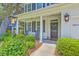 Welcoming front porch with rocking chairs and manicured landscaping, perfect for enjoying the outdoors at 2150 Terrabrook Ln, Charleston, SC 29412