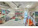 Spacious garage with ample storage shelving and room for multiple vehicles and equipment at 2150 Terrabrook Ln, Charleston, SC 29412