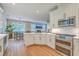 Open kitchen featuring stainless steel appliances, a breakfast bar, and views into the living area at 2150 Terrabrook Ln, Charleston, SC 29412
